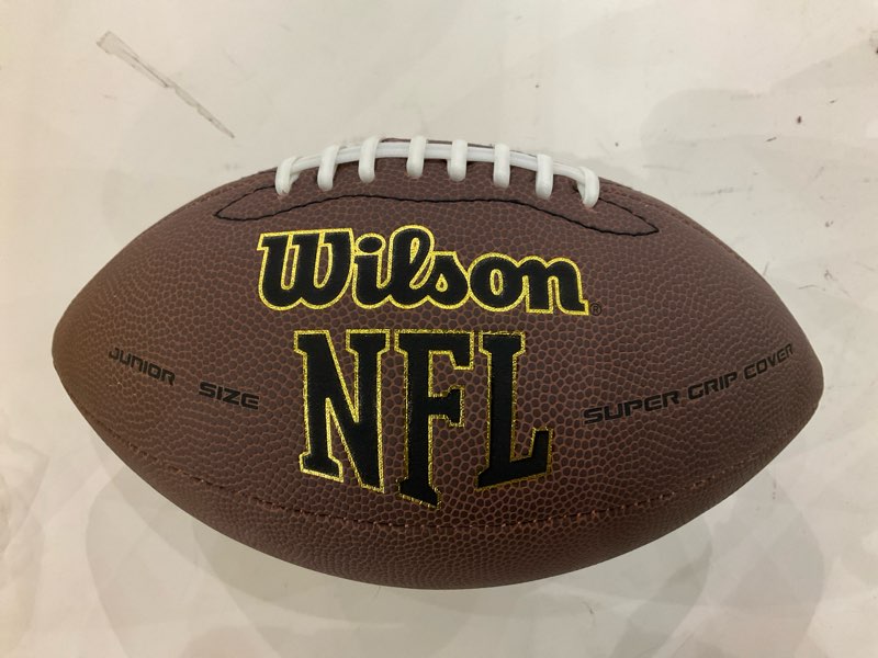 Condition photo showing New/Like New for WILSON NFL Super Grip Composite Footballs Brown Junior size (4th-6th grade; Ages 9-12)