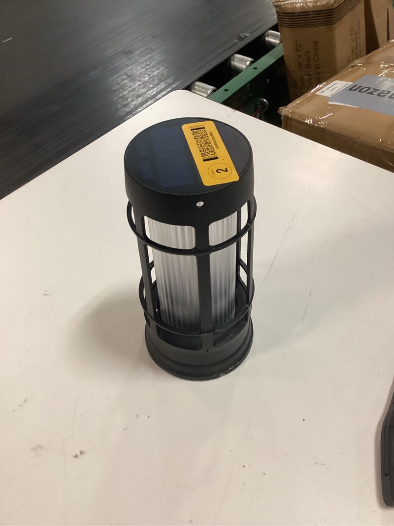 Condition photo showing As Is for decorative black solar lamp