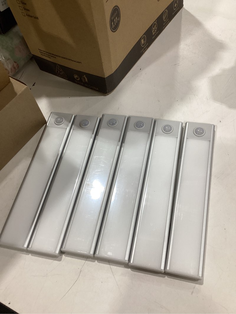Condition photo showing Good Condition for 6 pack under cabinet lights wireless, 32 led motion sensor light indoor rechargeable magnetic closet lights battery operated, under counter lights for kitchen, wardrobe, stairs, warm light 8inch warm white light