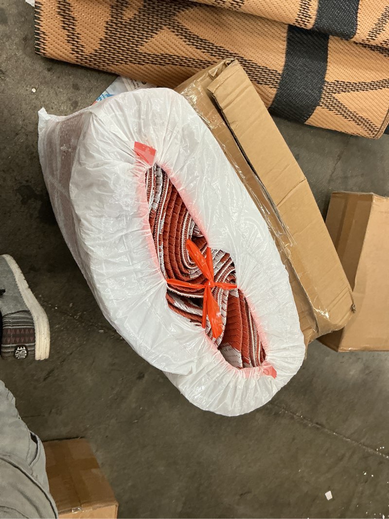 Condition photo showing As Is for fab habitat outdoor rug - waterproof, fade resistant, crease-free, reversible - premium recycled plastic - modern geometric - large patio, deck, sunroom, camping, rv - tokyo - burnt orange - 8 x10 ft