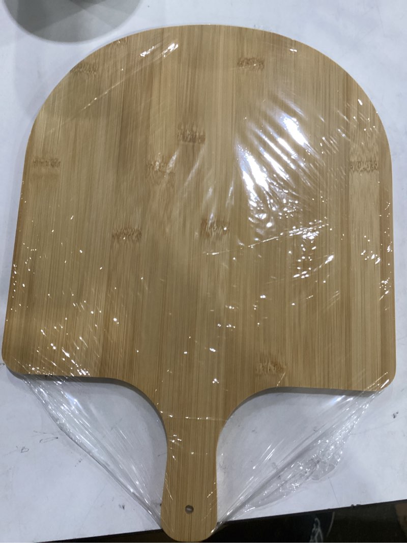 Condition photo showing New/Like New for gerrii wooden pizza peel 15.75 inches bamboo pizza peel cutting board pie platters paddle spatula with handle for baking oven vegetables fruits cheese board homemade kitchen accessory