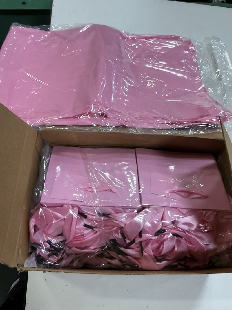 Condition photo showing Good Condition for qilery 50 pcs wedding paper gift bags bulk with tissue paper small gift bags with handle and tags for birthday wedding mothers' day party business(pink,4.7 x 2.4 x 3.9'') pink 4.7 x 2.4 x 3.9''