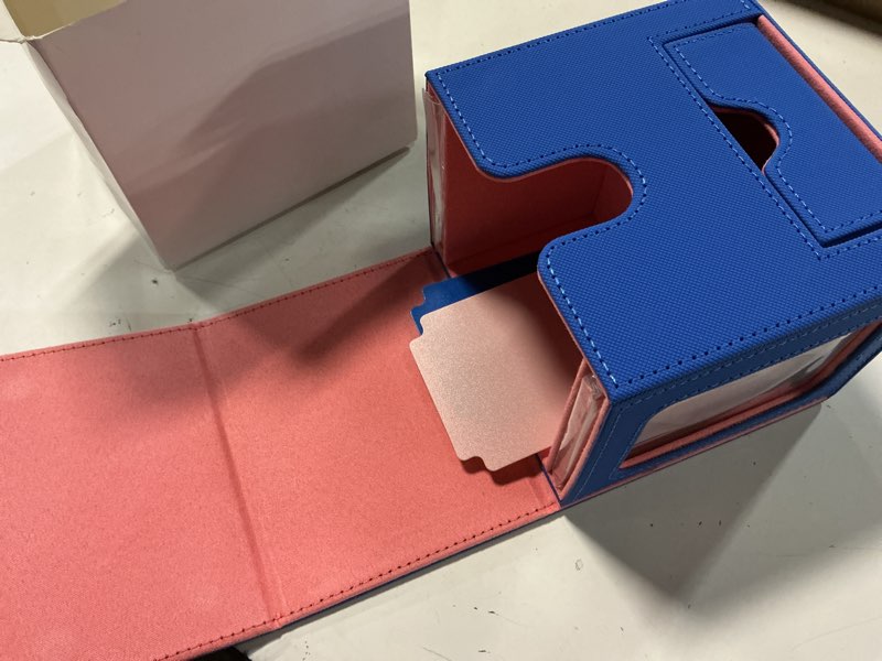 Condition photo showing New/Like New for mtg commander deck box with dual display windows and dice tray | fits 100 double-sleeved cards, pu leather, 2 magnetic card holders, 2 dividers, blue & pink 3. blue & coral pink