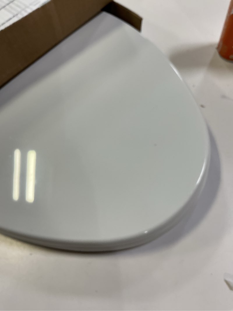 Condition photo showing As Is for KOHLER 20110-0 Brevia, Slow Close Toilet Seat, Elongated Toilet Seat, Grip-Tight Bumpers Quick-Attach Hardware, White White Elongated Quiet-Close