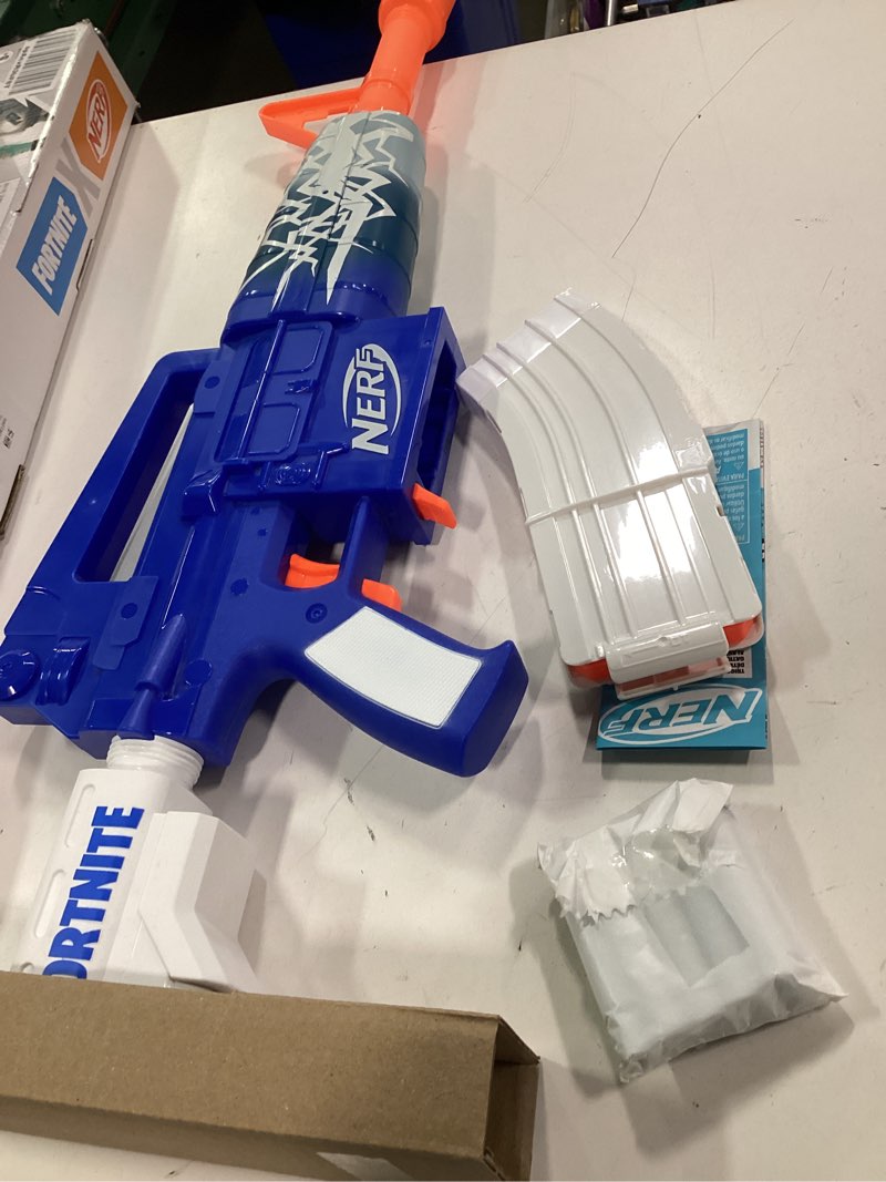 Condition photo showing New/Like New for Nerf Fortnite Blue Shock Blaster, 10-Dart Clip, 10 Elite Nerf Darts,  Unlock The Beat Wrap in The Game, Motorized Dart Blaster