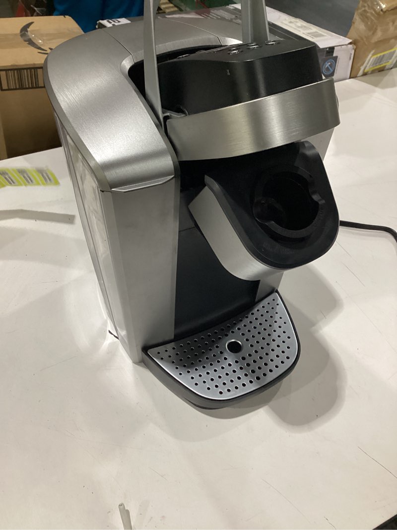 Condition photo showing Good Condition for **untested** keurig k-elite single serve k-cup pod coffee maker, with strength and temperature control, iced coffee capability, 8 to 12oz brew size, programmable, brushed silver