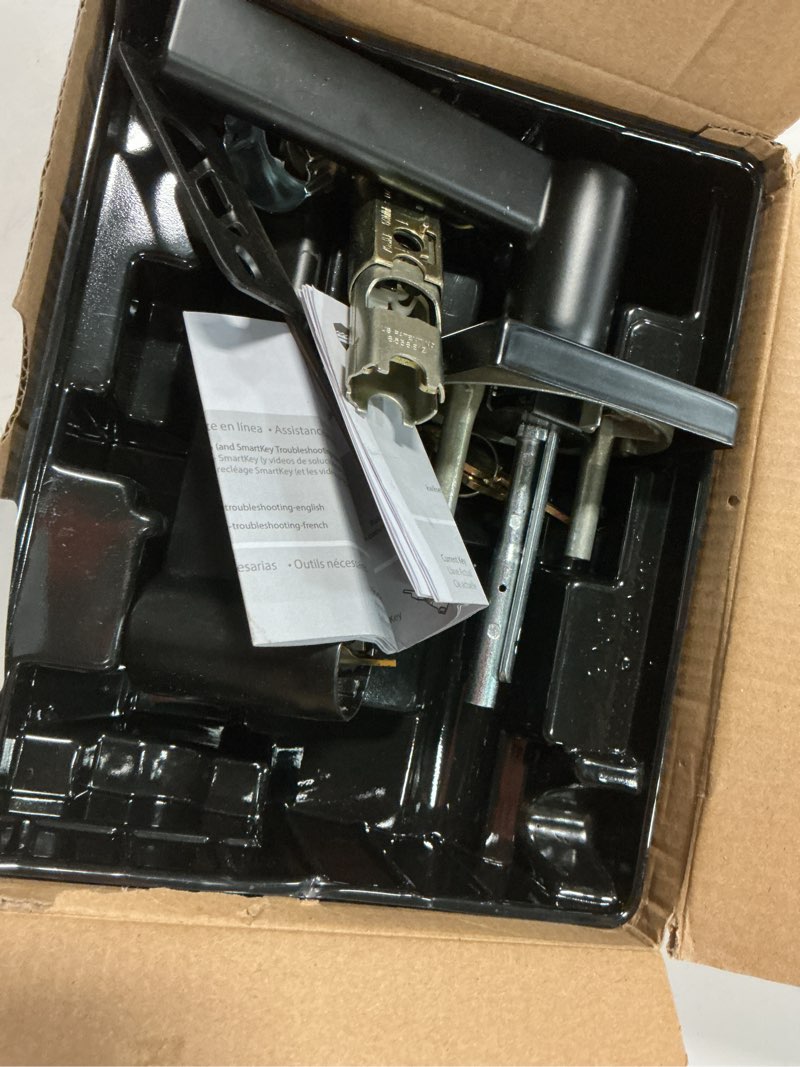 Condition photo showing As Is for kwikset casey entry door handle with lock and key, secure keyed reversible lever exterior, for front entrance and bedrooms, matte black , pick resistant smartkey rekey security and microban