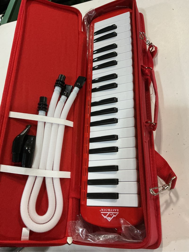 Condition photo showing Good Condition for eastrock 37 key melodica instrument air piano keyboard soprano style pianica with mouthpiece tube sets and carrying bag black 37key red
