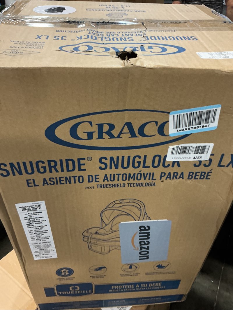 Condition photo showing New/Like New for Graco SnugRide SnugLock LX Car Seat featuring TrueShield Technology Ion