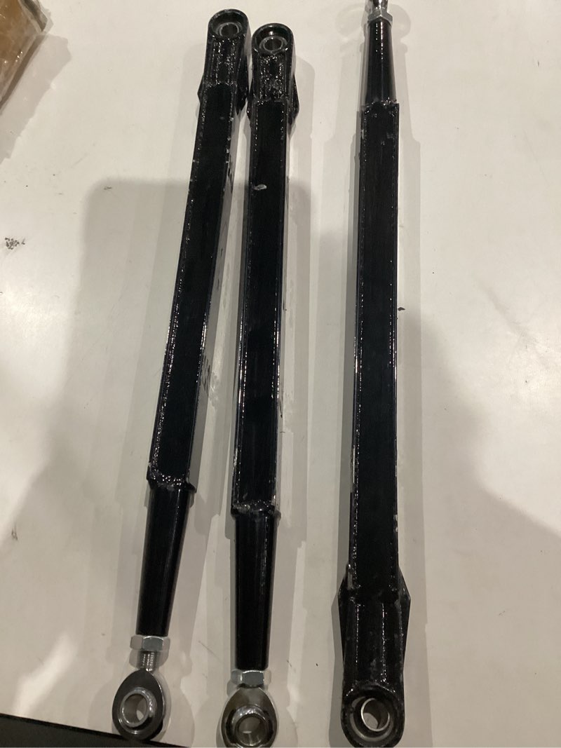 Condition photo showing As Is for heavy-duty rear radius arms kit for 2017–2023 can-am maverick x3 72" (x rc/rs/mr/max), pre-adjusted steel boxed arms with heim joints, suspension upgrade