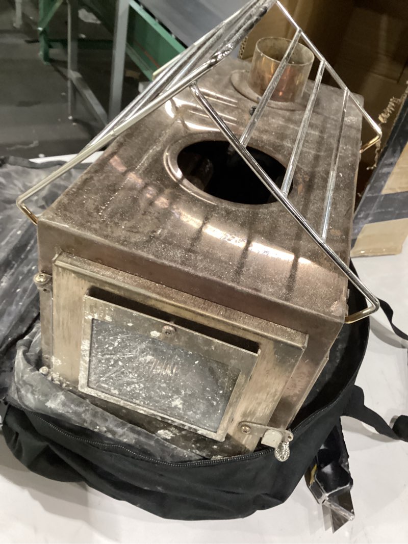 Condition photo showing As Is for Winnerwell Nomad Medium Tent Stove | Tiny Portable Wood Burning Stove for Tents, Shelters, and Camping | 800 Cubic Inch Firebox | Precision Stainless Steel Construction | Includes Chimney Pipe