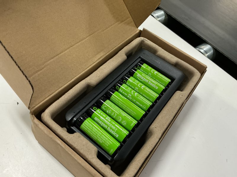 Condition photo showing New/Like New for amazon basics rechargeable aa low self discharge nimh batteries with 8-bay battery charger, usb-c port, no ac power adapter, 8 count, black 8 aa + 8 bay charger