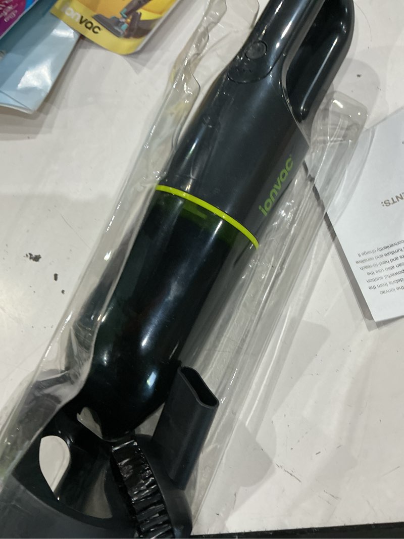 Condition photo showing As Is for tzumi ionvac handvac, cordless handheld vacuum with usb-charging and multiple attachments - green