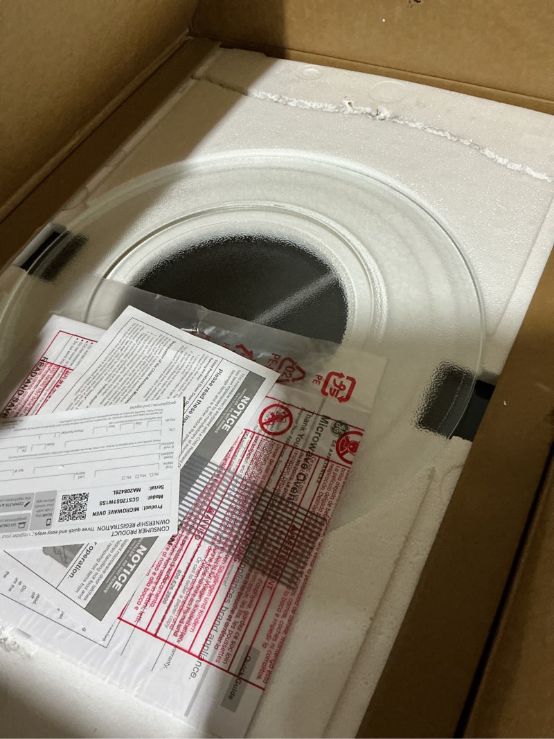 Condition photo showing As Is for GE Countertop Microwave Oven,1, 200-watt Capacity, 2.0 Cubic Ft., 8 Auto Setting Cooking Settings, Child-Lock Technology, Kitchen Essentials for the Countertop, Dorm Room or Apartment, Stainless Steel 2.0 Cu.Ft. Stainless Steel