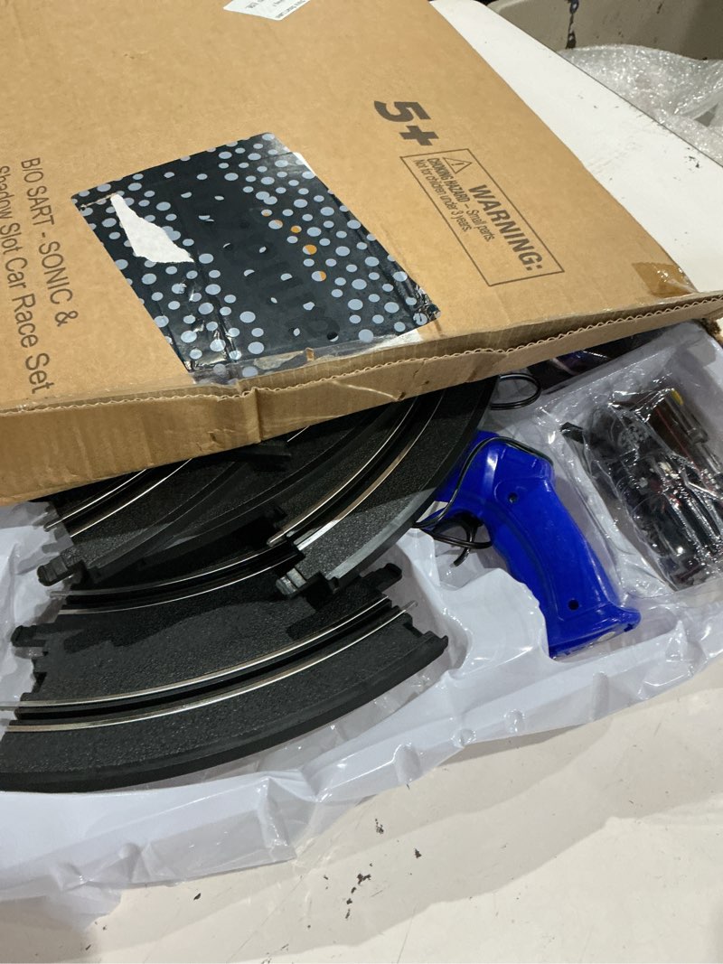 Condition photo showing As Is for nkok sonic and shadow race track set with working lights, lap counter, figure-8 slot car track, brown box packaging sonic & shadow