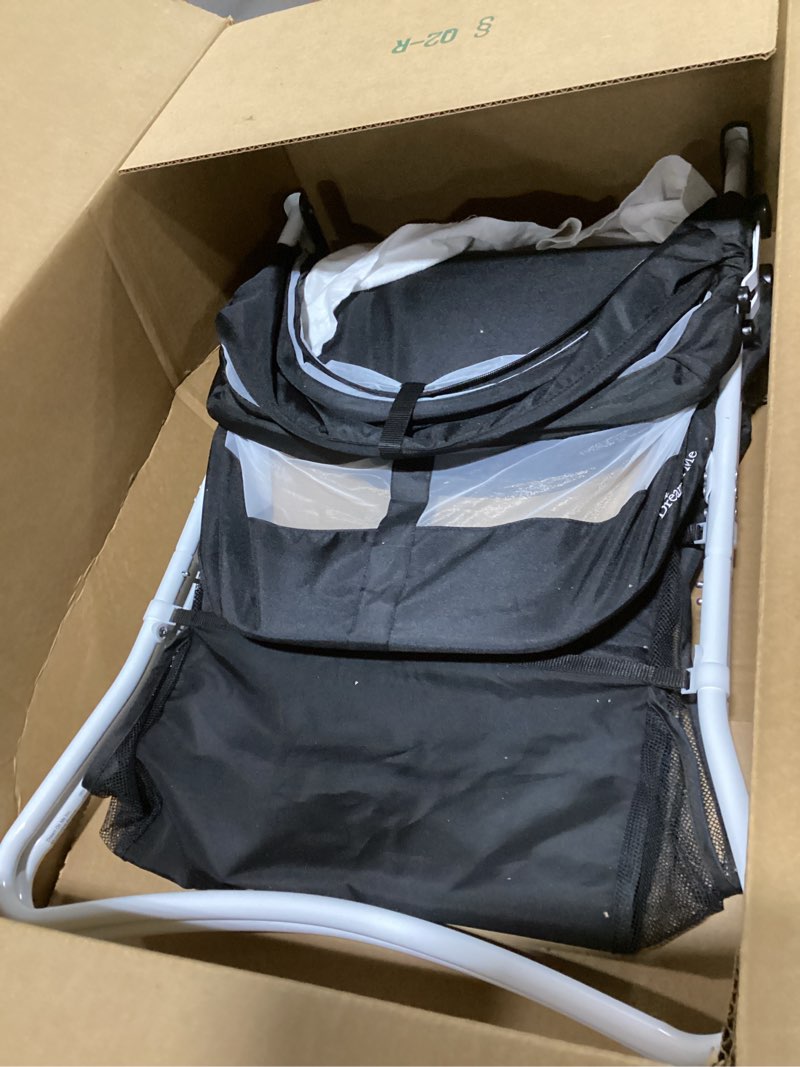 Condition photo showing Good Condition for dream on me karley bassinet in black, lightweight portable baby bassinet, quick fold and easy to carry, adjustable double canopy, indoor and outdoor bassinet with large storage basket.