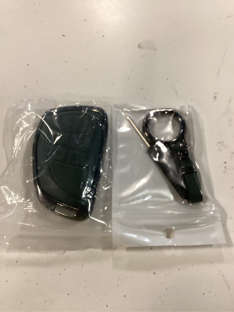 Condition photo showing Good Condition for ollen 6 button metal key fob cover, compatible with gmc yukon sierra 2021-2026, fit for chevy silverado suburban tahoe buick envision, key case with zinc alloy frame and keyring, green green 6 buttons