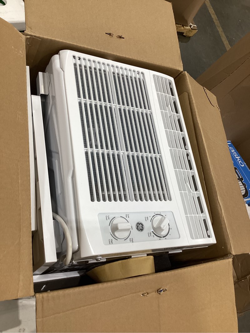 Condition photo showing As Is for ge appliances 5000 btu mechanical window air conditioner unit