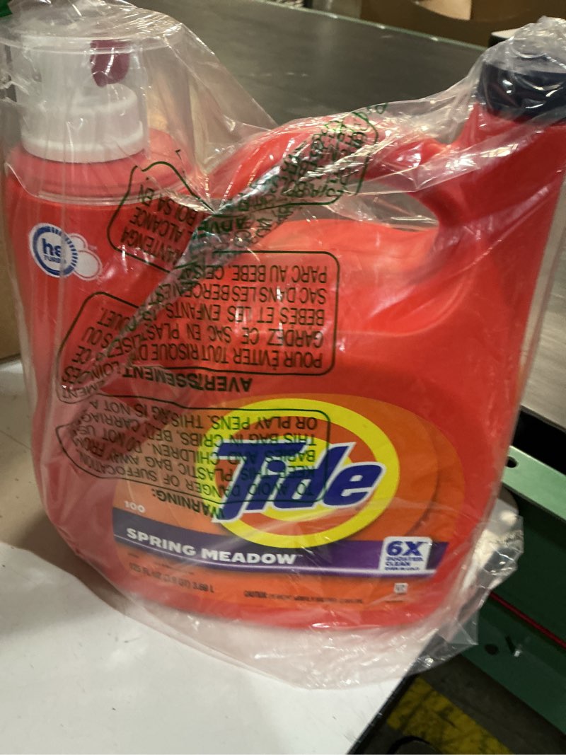 Condition photo showing New/Like New for tide laundry detergent liquid with 6x boosted cleaning power  spring meadow scent  125 fl oz  100 loads