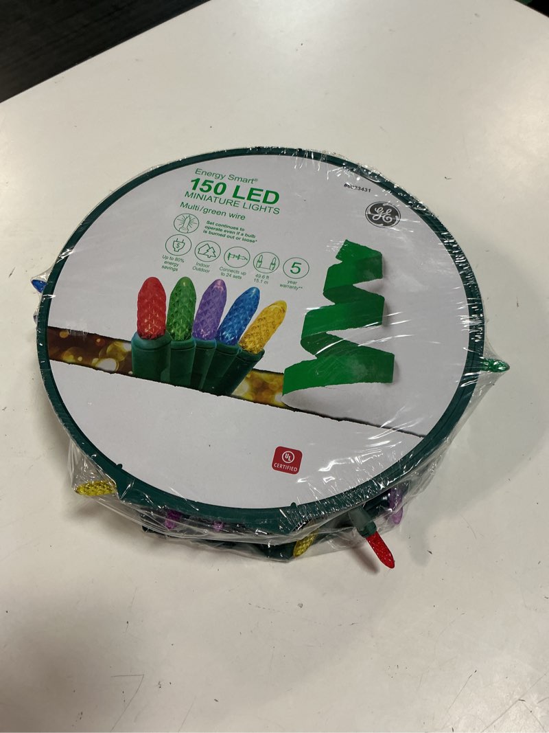 Condition photo showing New/Like New for energy smart 150 led miniature lights multi/green wire 