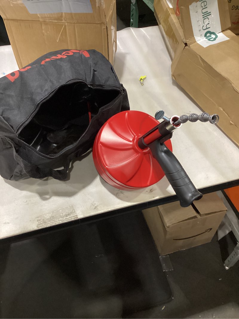 Condition photo showing As Is for Drain Snake 50 Ft, Plumbing Snake for Sink with Drill Attachment, Snake Drain Clog Remover for Shower Drain, Kitchen, and Sink, Manual or Powered Use, Comes with Gloves and Storage Bag, 1/4 Inch, Red