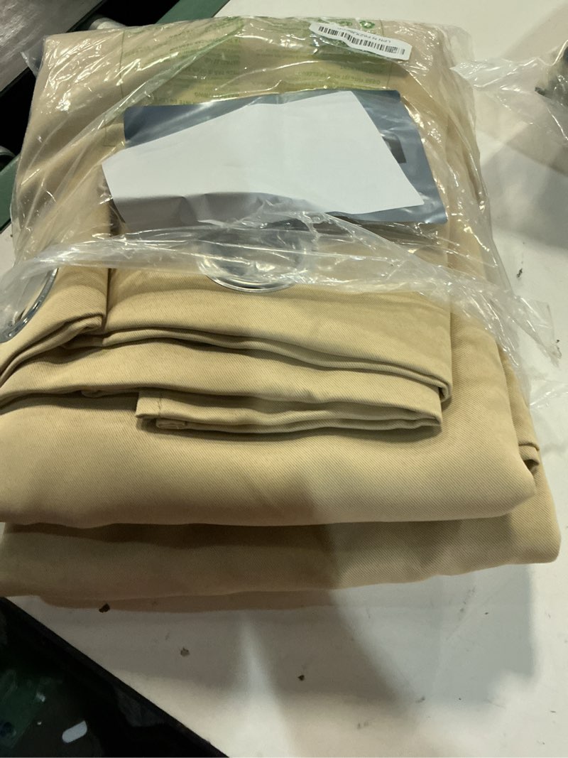 Condition photo showing Good Condition for nicetown blackout draperies curtains panels - window treatment thermal insulated solid grommet blackout curtains/panels/drapes for bedroom (biscotti beige, set of 2, 66 by 72 inch) biscotti beige 66"w x 72"l (pack of 2)
