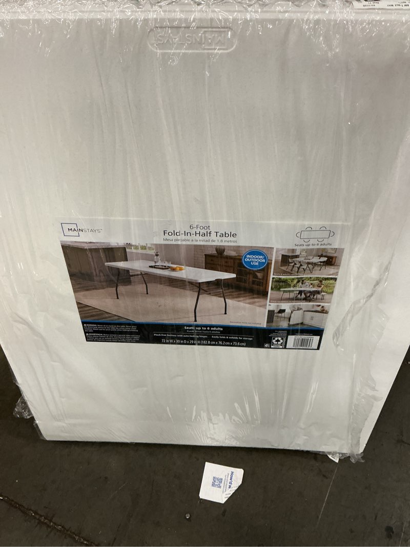 Condition photo showing Good Condition for mainstays 6' premium rectangle centerfold folding table, white