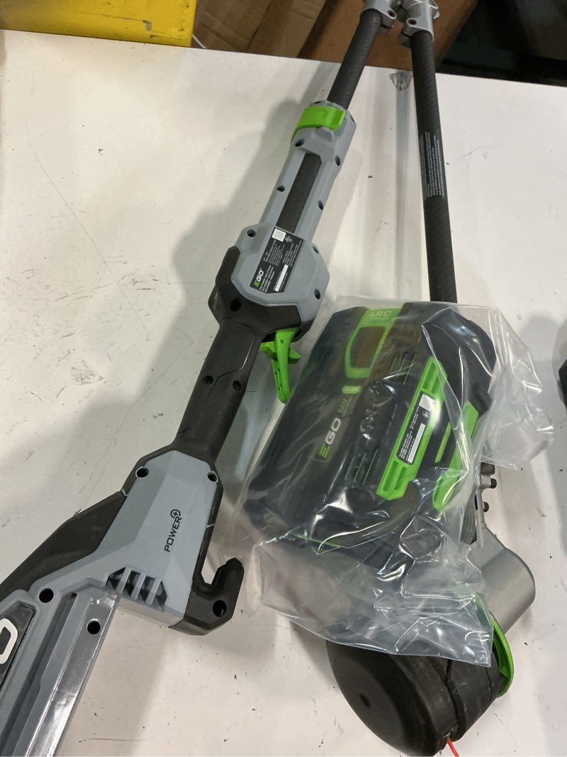 Condition photo showing As Is for ego power+ string trimmer, battery powered, 15" trimmer for weeds and grass with rapid reload, split shaft, includes 56v 2.5ah battery and charger - st1502sa w/2.5ah battery, rapid reload