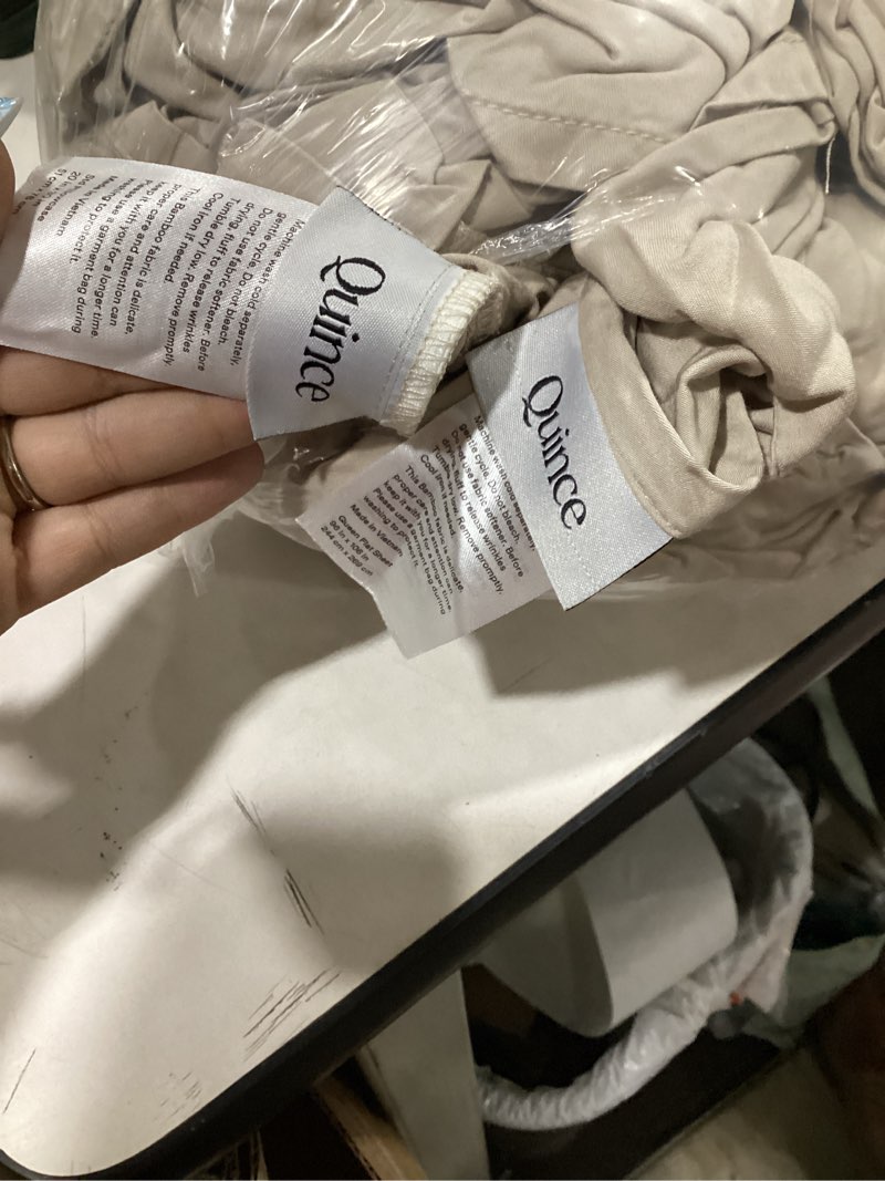 Condition photo showing As Is for queen bed sheet set beige quince