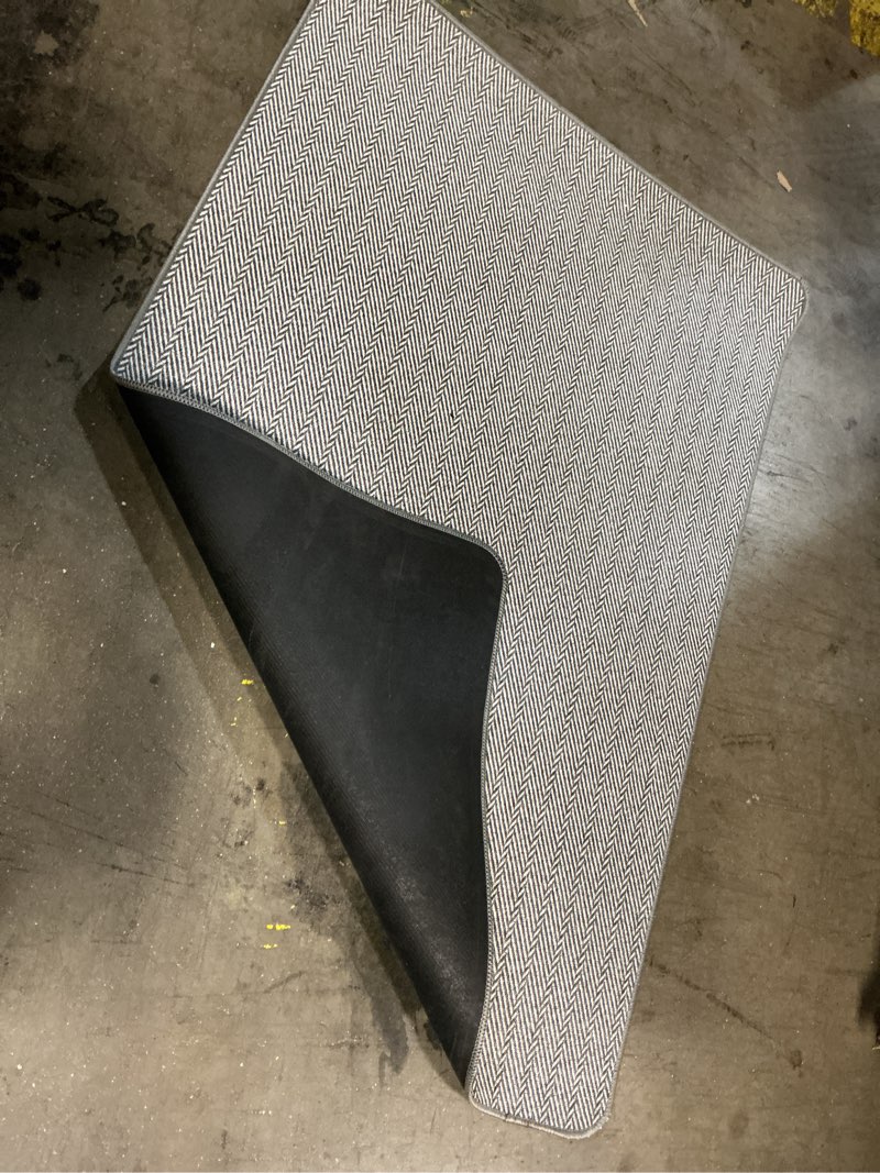 Condition photo showing As Is for Nourison Home Textured are rug 2’X3’ 