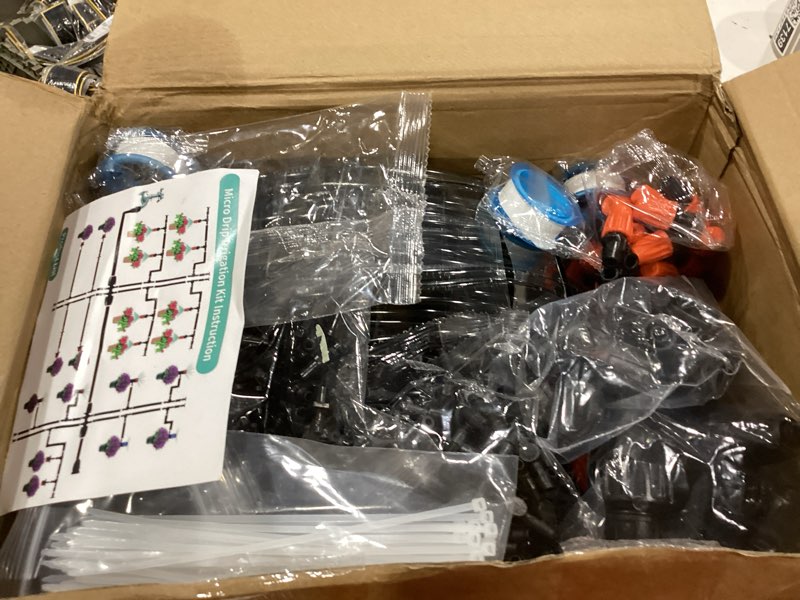 Condition photo showing Good Condition for 590 ft drip irrigation system kit misting plant watering system with 1/4 inch 1/2 inch irrigation tubing hose adjustable nozzle emitters barbed fittings for garden yard lawn