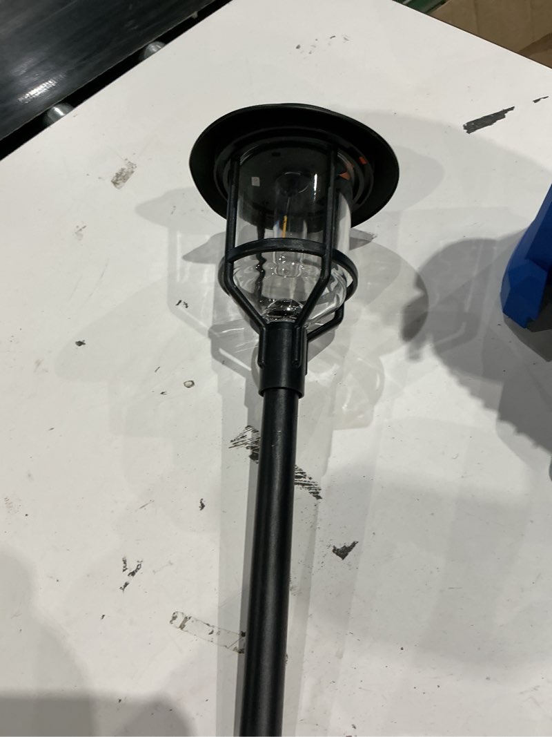 Condition photo showing As Is for harbor breeze 15 -lumens black solar led outdoor path light with dusk-to-dawn sensor