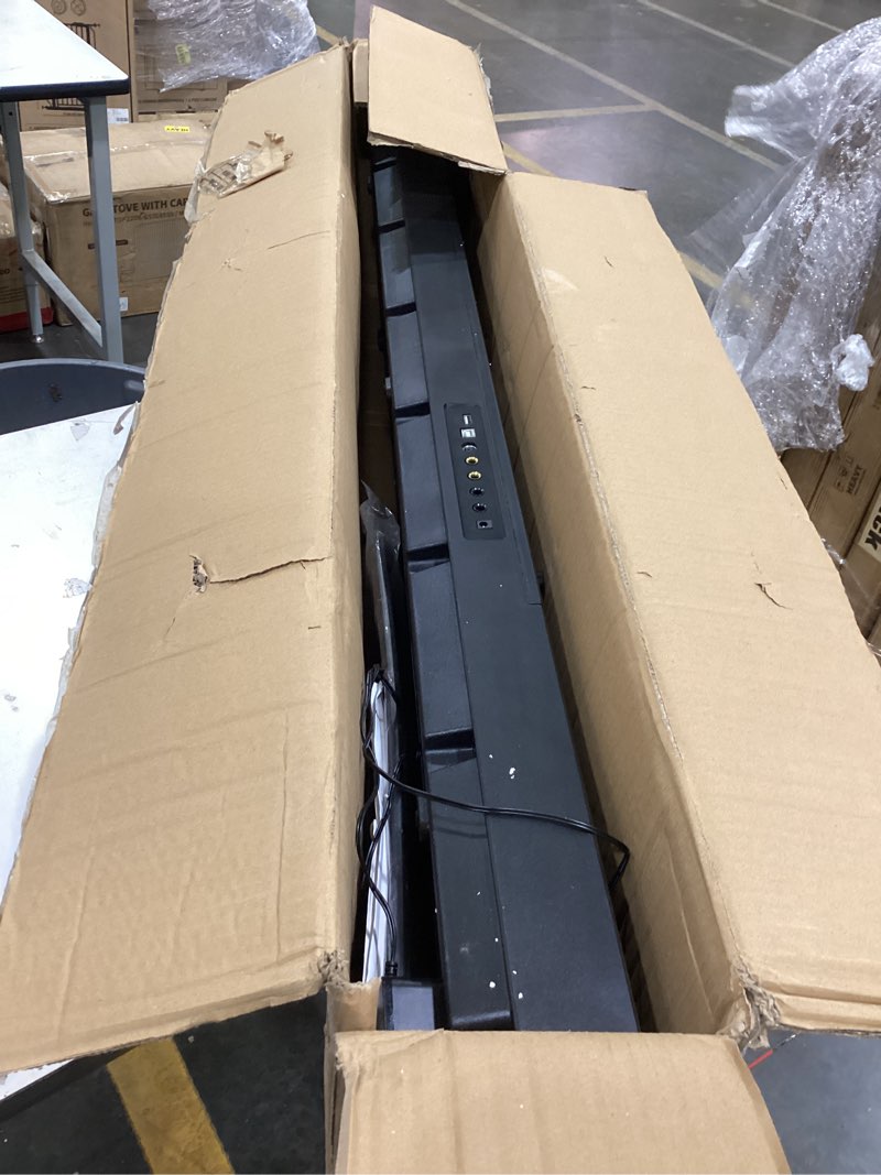 Condition photo showing As Is for amazon basics electric keyboard with 88-keys, semi-weighted digital piano with sustain pedal, power supply, 2 speakers, lesson mode, black