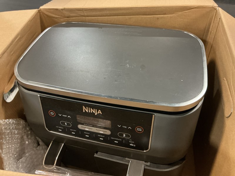 Condition photo showing Good Condition for Ninja DZ201 Foodi 8 Quart 6-in-1 DualZone 2-Basket Air Fryer with 2 Independent Frying Baskets, Match Cook & Smart Finish to Roast, Broil, Dehydrate & More for Quick, Easy Meals, Grey
