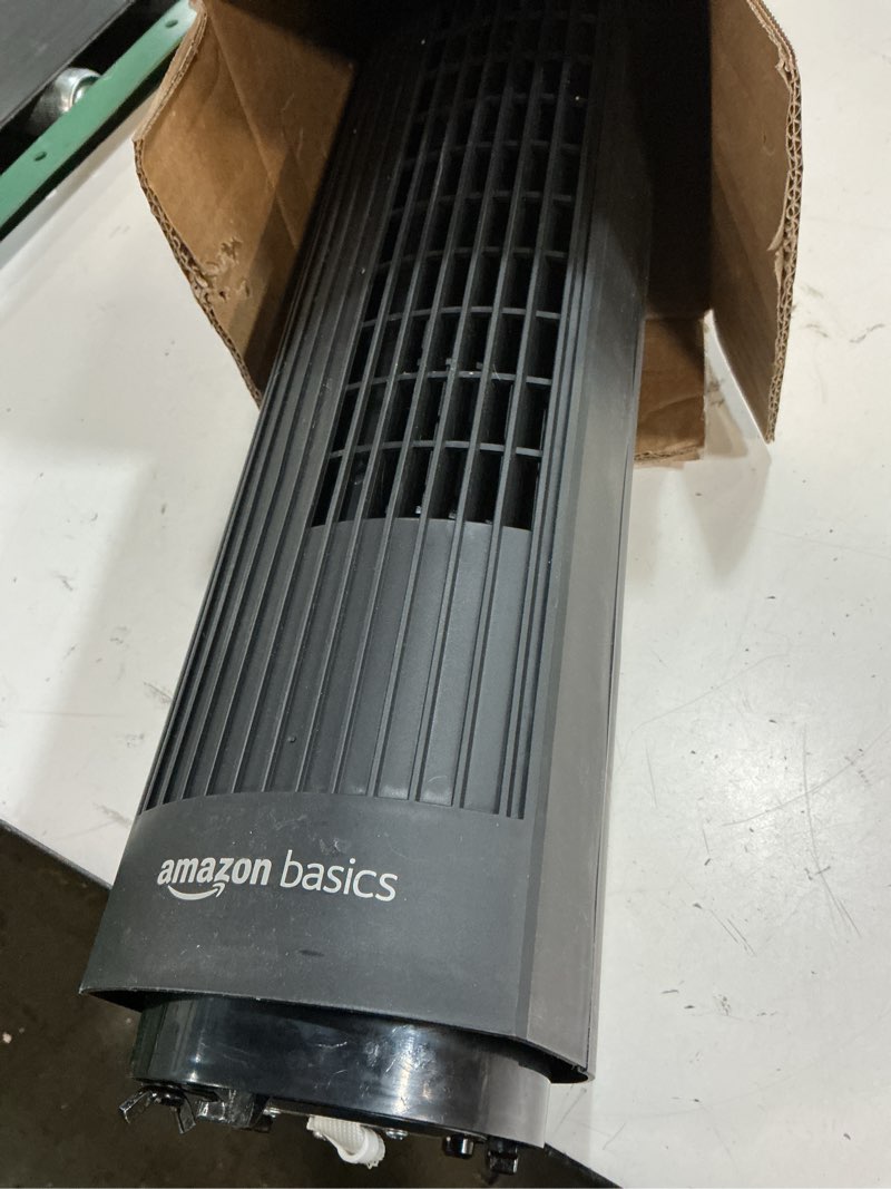 Condition photo showing As Is for amazon basics 28" 60-degree oscillating tower fan for bedroom, living room, office, with 3 speeds, intuitive mechanical control, black, 35w, 27.8"h x 9.4"d x 9.4"w 28" - mechanical control