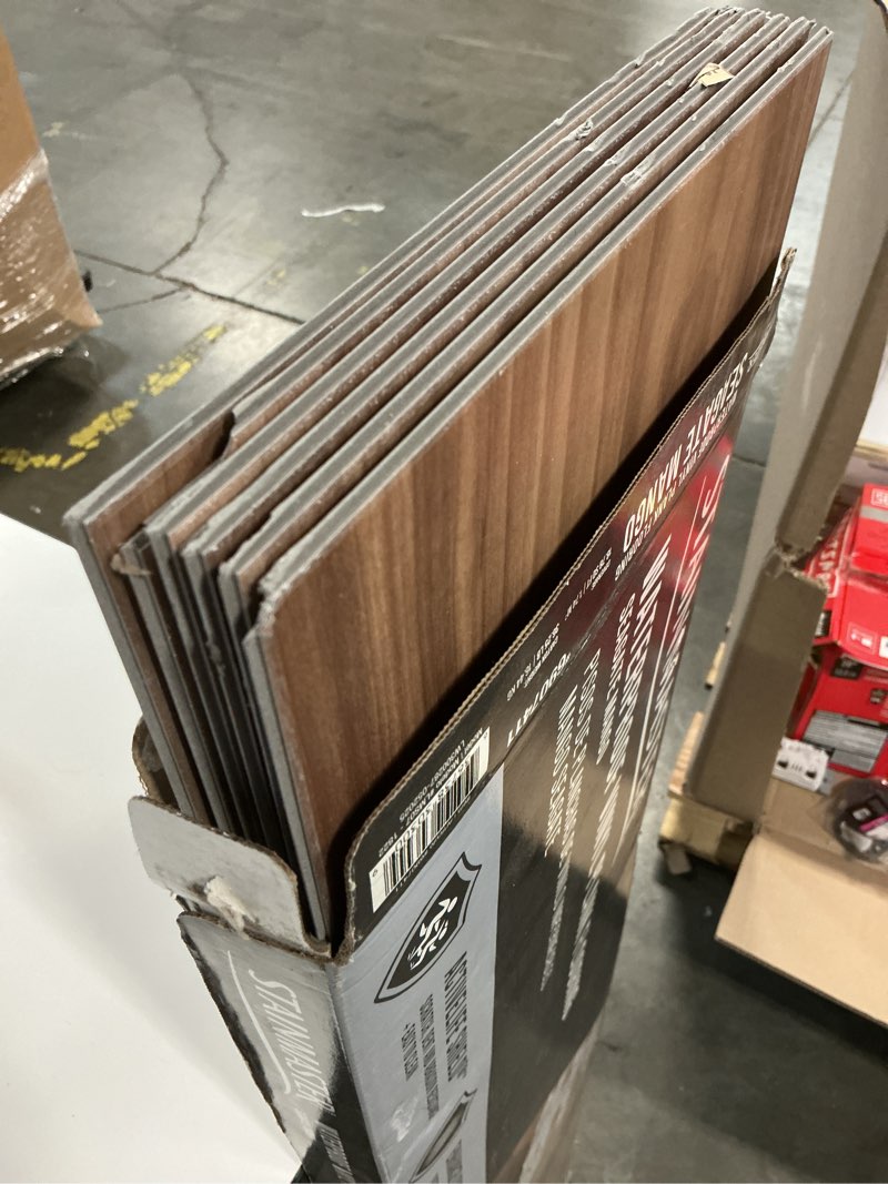 Condition photo showing As Is for stainmaster seagate mango 22-mil x 9-in w x 47-in l waterproof luxury vinyl plank flooring ( 18.78-sq ft per carton )