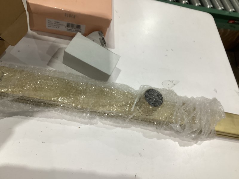 Condition photo showing Good Condition for 32 inch linear shower drain, brushed gold shower drain, removable grate, 304 stainless steel, easy to install and clean for bathrooms (drain base not included), lsd-29a-32g brushed gold 32 inch