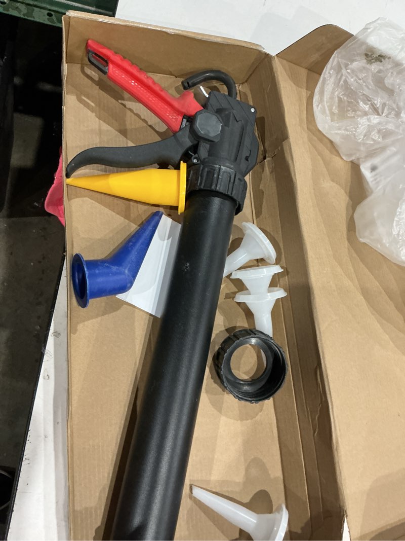 Condition photo showing As Is for heavy duty caulking gun (25:1 thrust) - compatible with 20 oz sausage packs & 10 oz cartridges, includes replaceable nozzle tips - red handle