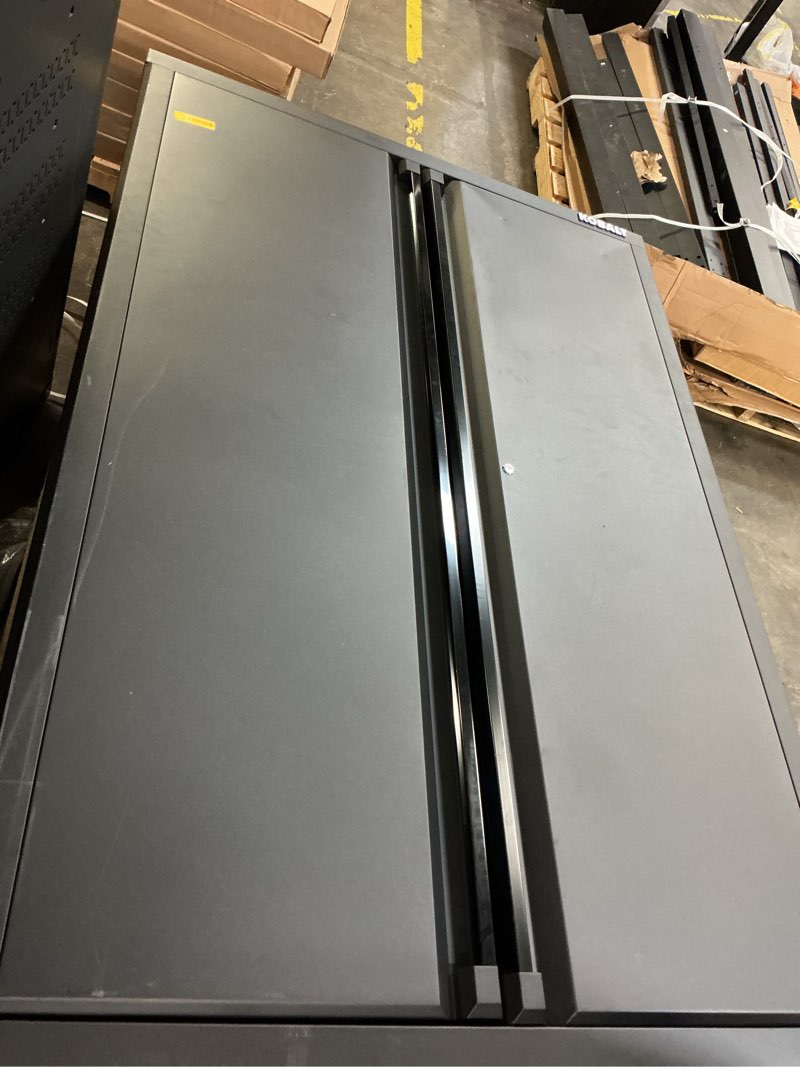 Condition photo showing As Is for kobalt 48-in w x 72-in h x 18.5-in d freestanding steel garage cabinet in black