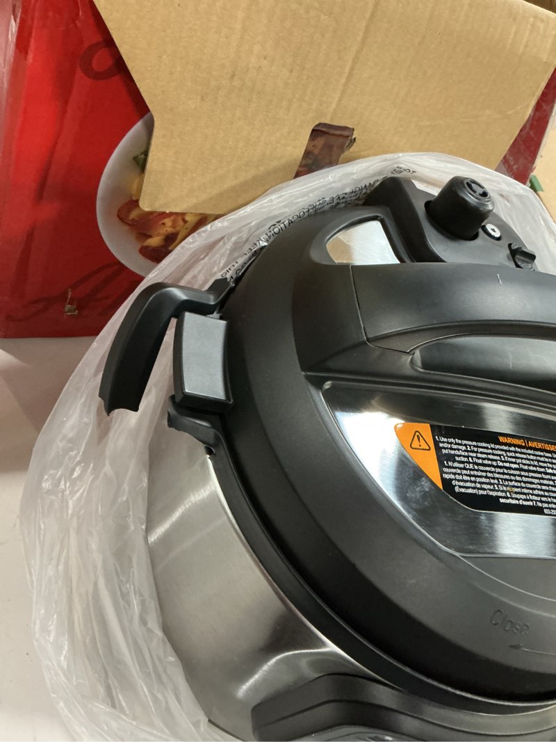 Condition photo showing As Is for instant pot duo 7-in-1 electric pressure cooker, slow cooker, rice, steamer, sauté, yogurt maker, warmer & sterilizer, includes app with over 800 recipes, stainless steel, 6 quart 6 quarts