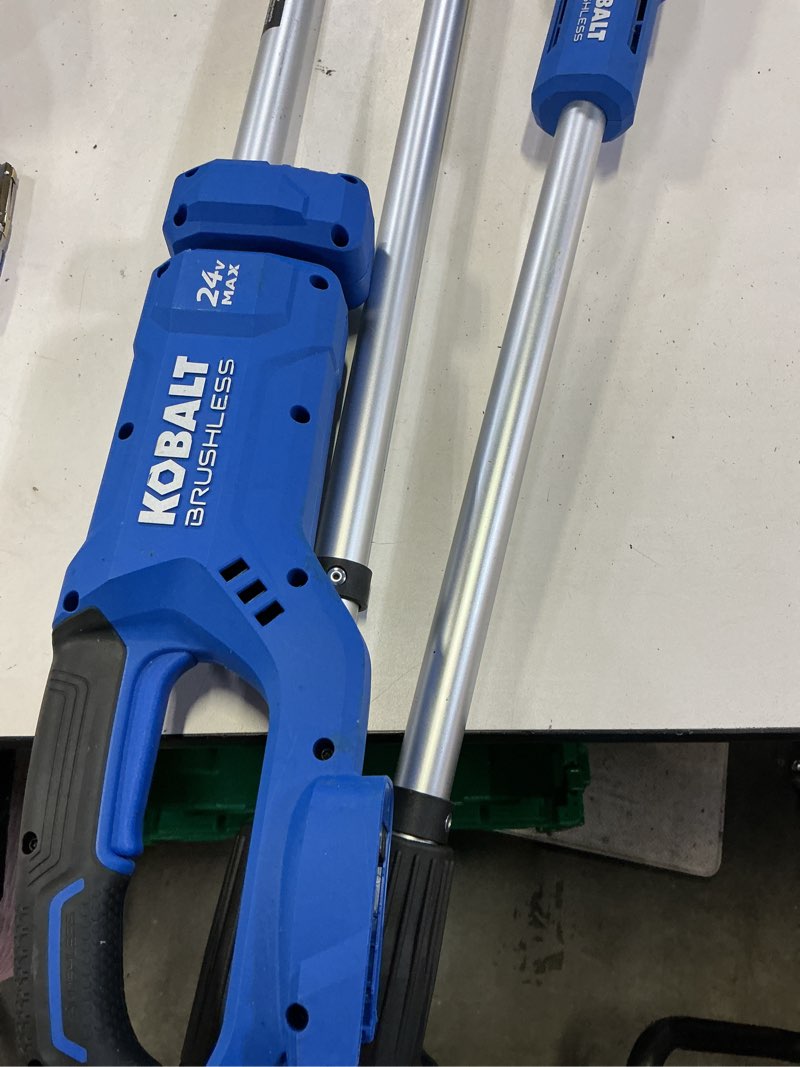 Condition photo showing As Is for kobalt 24-volt 8-in 2 ah electric pole saw battery included , charger included