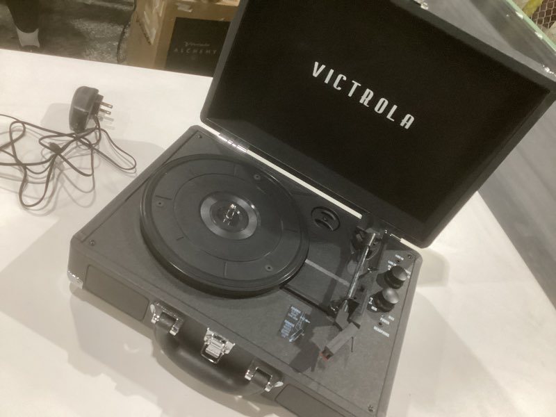Condition photo showing As Is for victrola journey+ cassette – 3-speed bluetooth suitcase turntable with built-in speakers, cassette player & vinyl stream technology, rca output & aux in support (black), not tested