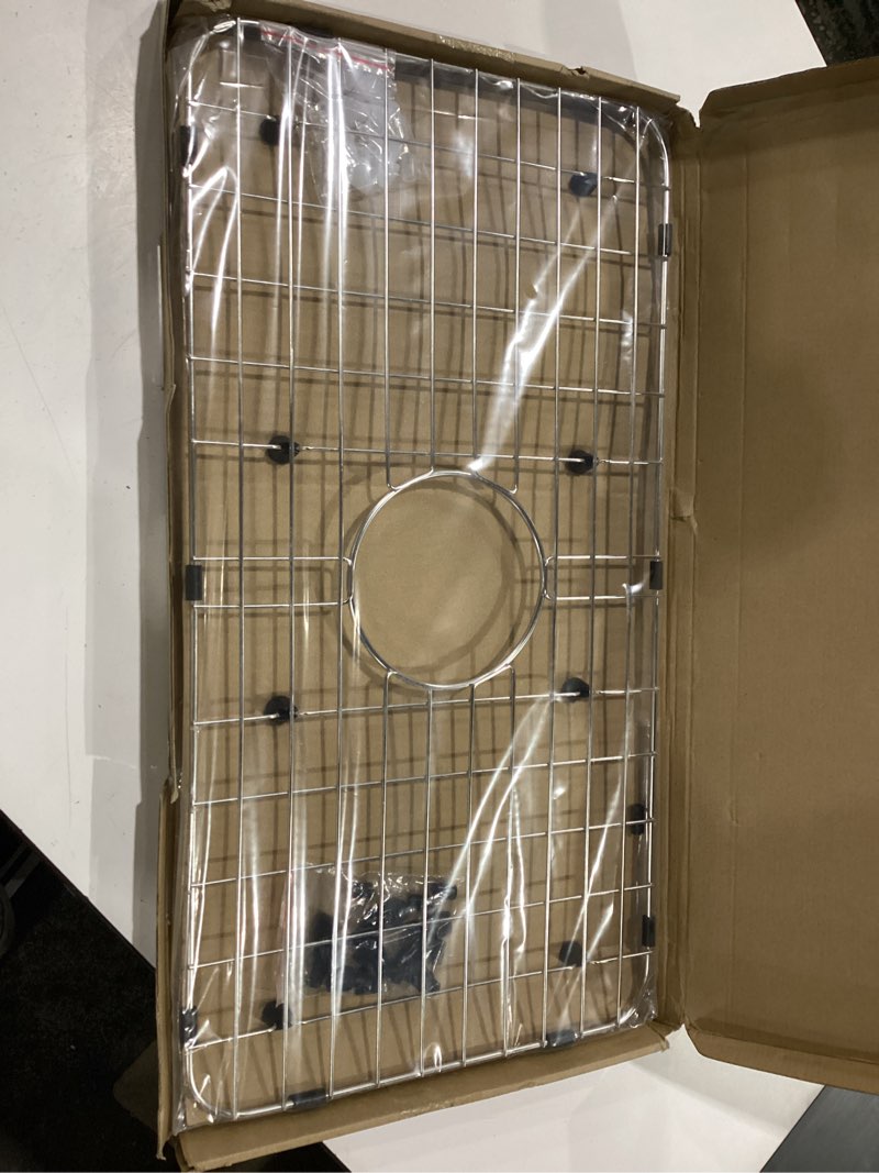 Condition photo showing New/Like New for serene valley sink bottom grid 24-1/8" x 12-5/8", centered drain with corner radius 1-1/2", sink protector nlw2412c