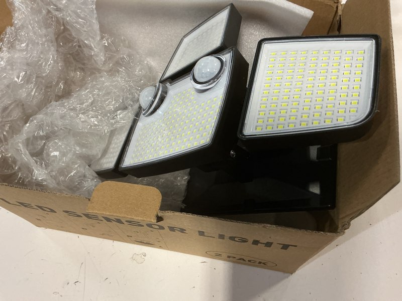Condition photo showing Good Condition for tuffenough solar outdoor lights with motion sensor - 2500lm bright 4 heads led security flood light with 2 sensors - 3 modes solar powered detected wall lamp fixtures waterproof for outside yard 2 pack