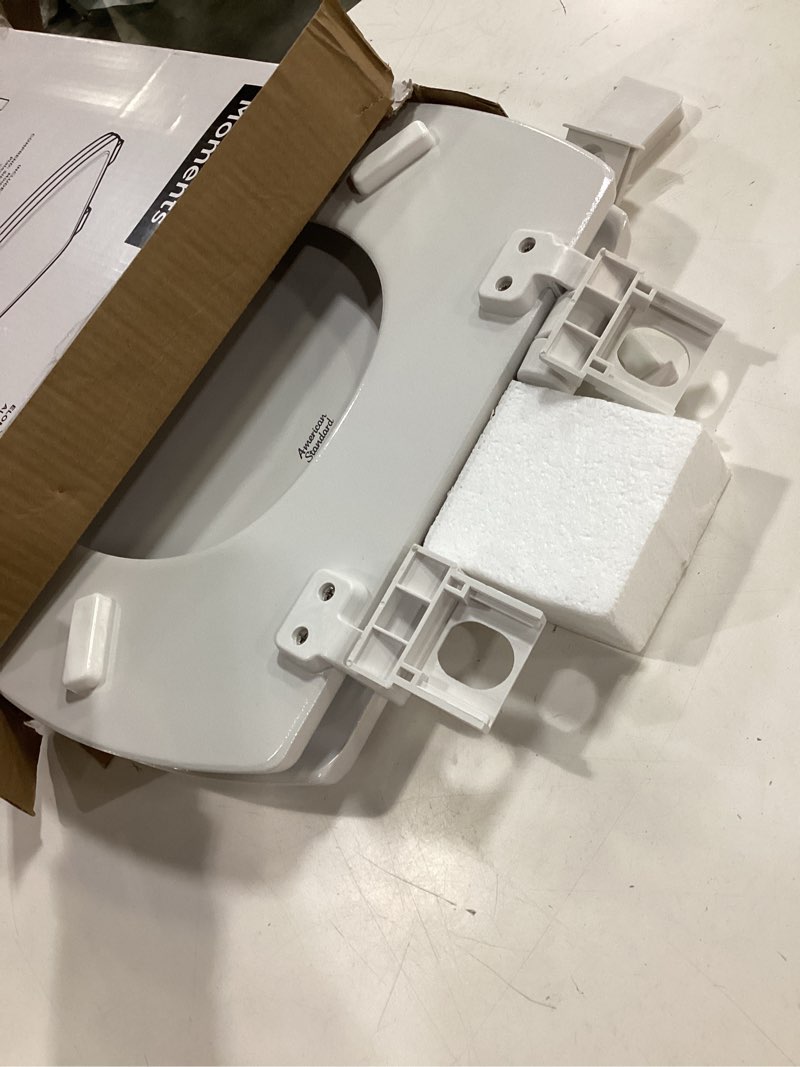 Condition photo showing As Is for american standard moments wood white elongated soft close toilet seat