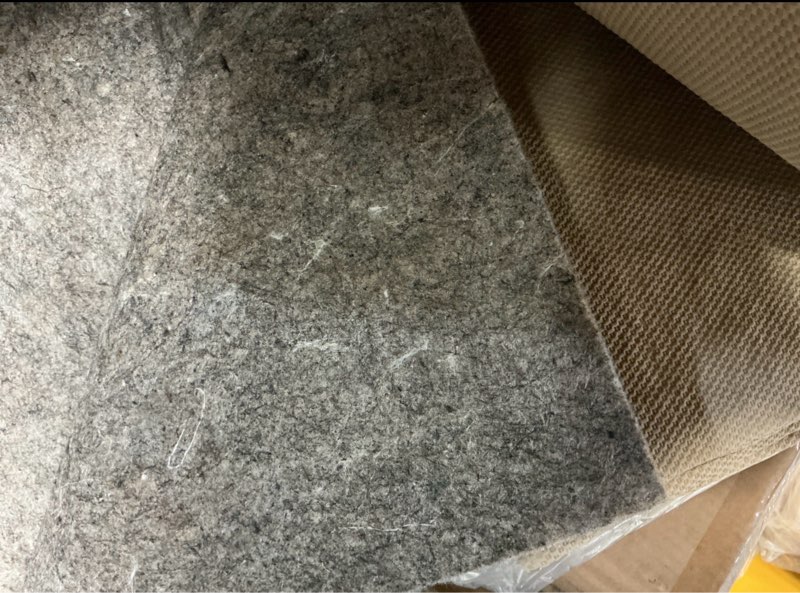 Condition photo showing As Is for premium low profile rug pad 8' x 10'