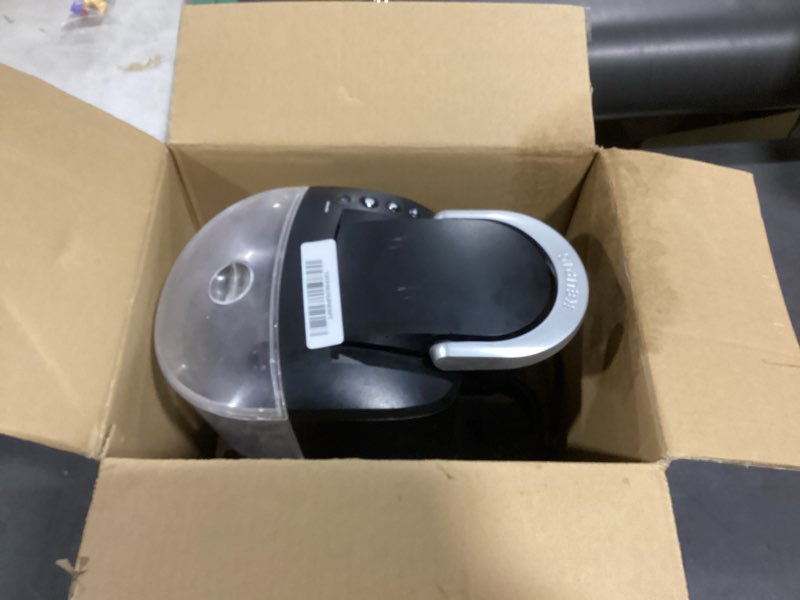 Condition photo showing As Is for incomplete keurig k-compact single-serve k-cup pod coffee maker, with 3 brew sizes, smart start feature, 36oz removable reservoir, black