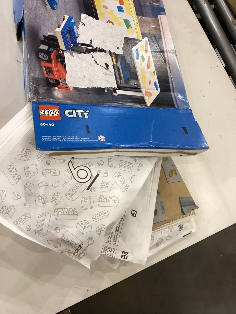 Condition photo showing Good Condition for lego city yellow delivery truck toy, comes with a semitruck model, forklift and 4 minifigures for pretend play, fun birthday gift idea for kids' 8 years old and up, 60440