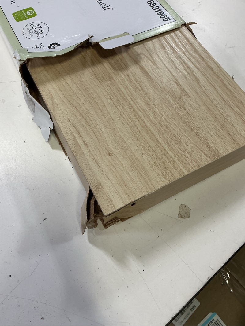 Condition photo showing As Is for allen + roth 8-in d x 24-in l light wood composite wood rectangular floating shelf