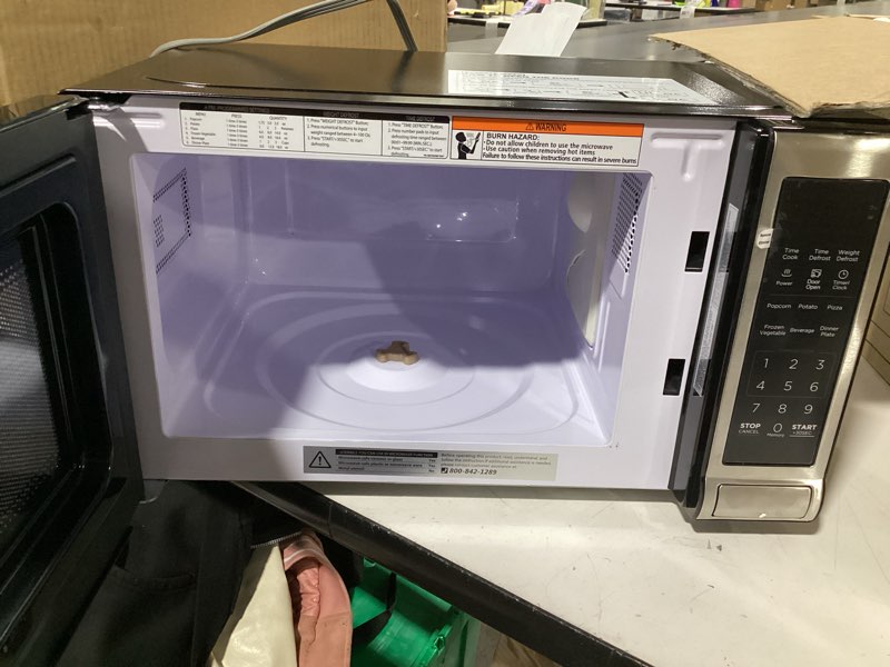 Condition photo showing As Is for (Missing plate)BLACK+DECKER EM720CB7 Digital Microwave Oven with Turntable Push-Button Door, Child Safety Lock, 700W, Stainless Steel, 0.7 Cu.ft